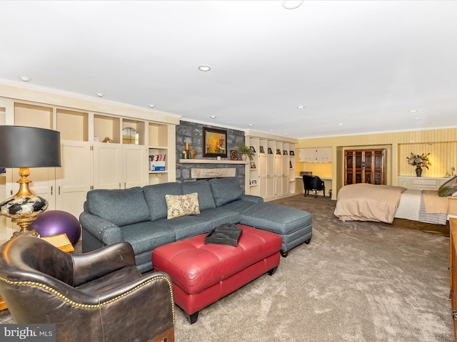 carpeted living room with a stone fireplace and ornamental molding