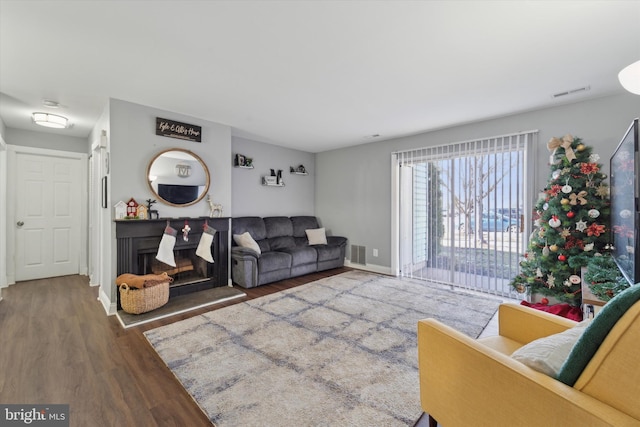 living room with dark hardwood / wood-style flooring