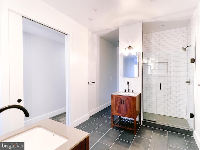 bathroom featuring vanity and an enclosed shower