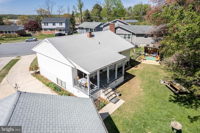 drone / aerial view with a residential view