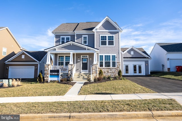 TBB Westmoreland Way Clemson Ii, Charles Town, WV 25414 - craftsman inspired home with covered porch, stone siding, board and batten siding, and a front lawn