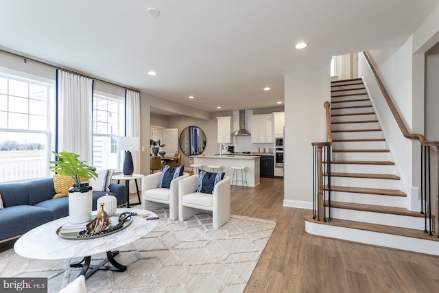 TBB Westmoreland Way Clemson Ii, Charles Town, WV 25414 - living room featuring light wood-style floors, recessed lighting, stairs, and baseboards