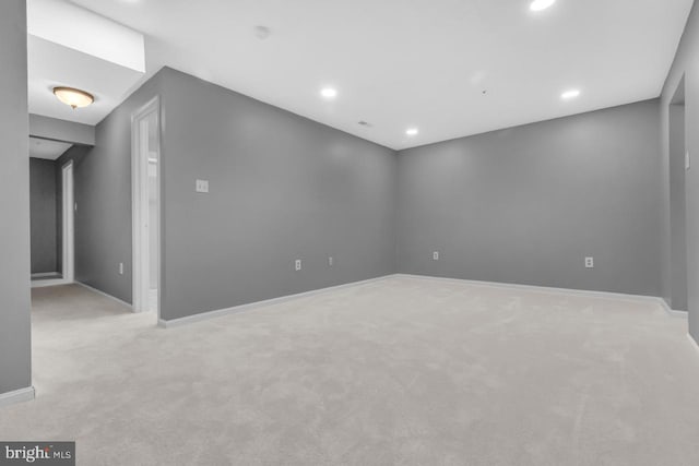 unfurnished room with light colored carpet