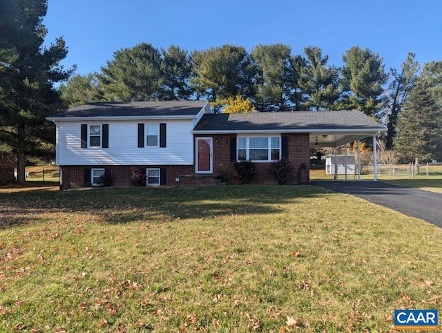 tri-level home with a carport and a front yard