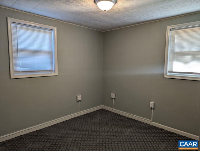 carpeted empty room with crown molding