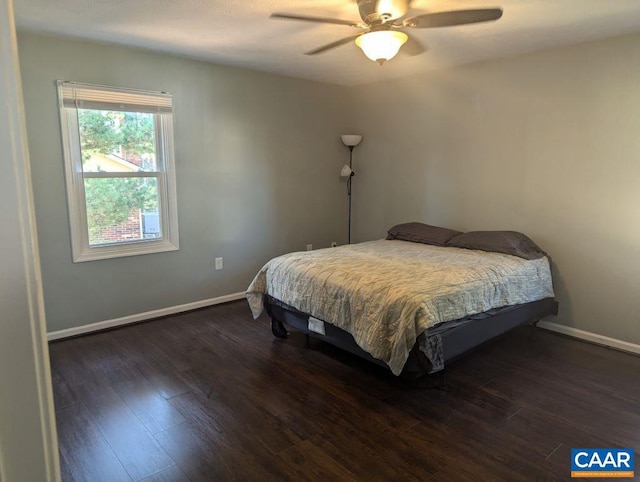 bedroom featuring ceiling fan and dark wood-type flooring