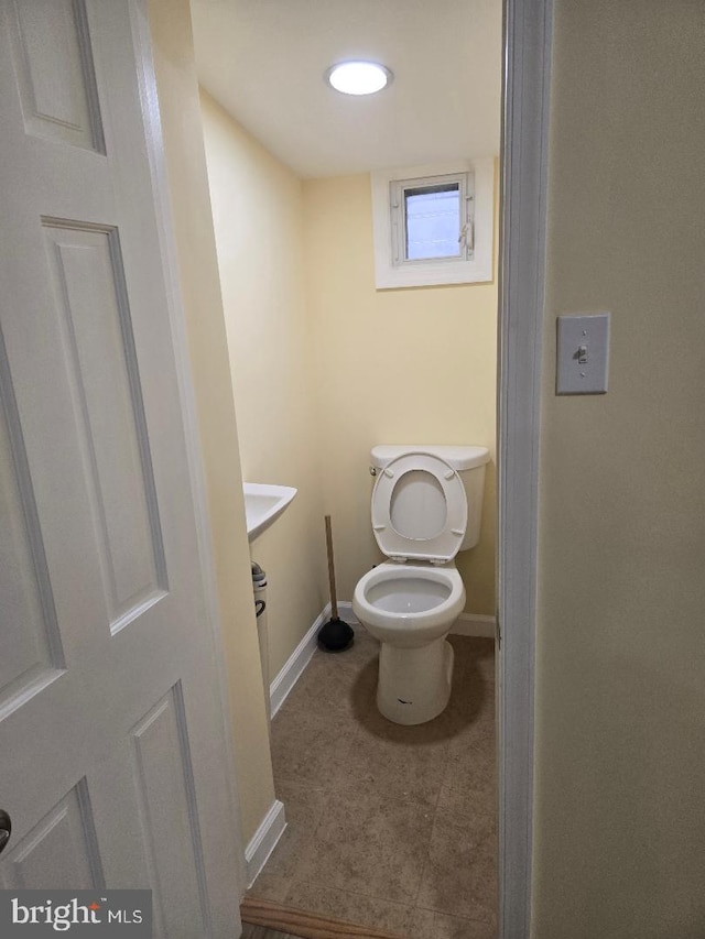 bathroom featuring toilet