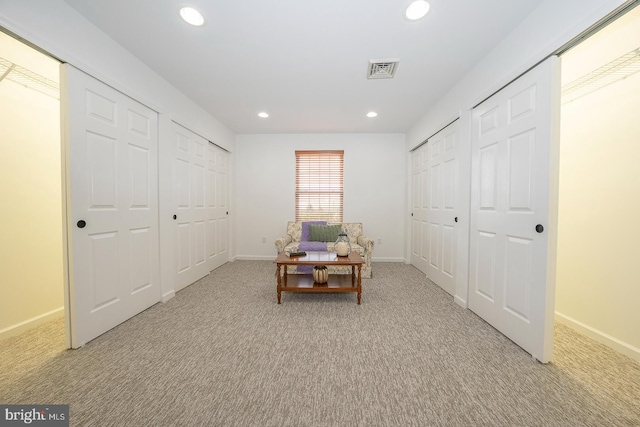 interior space featuring light carpet