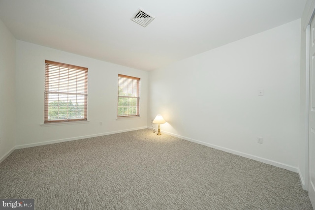 unfurnished room featuring carpet floors