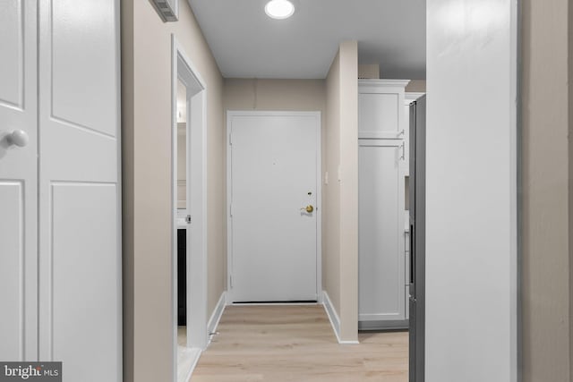 hallway featuring light hardwood / wood-style flooring