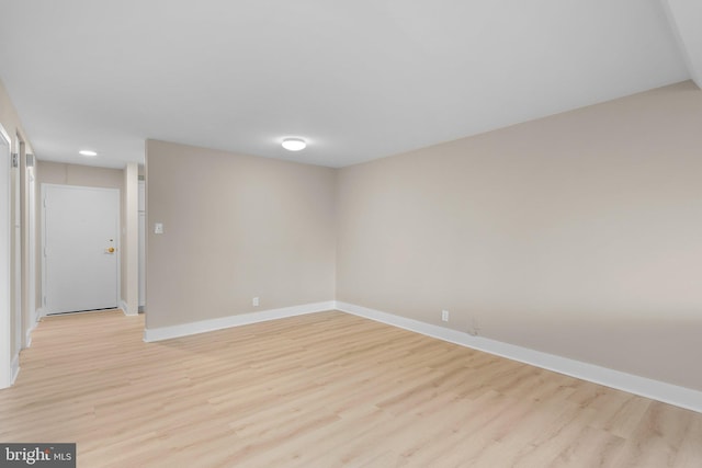 spare room featuring light hardwood / wood-style flooring