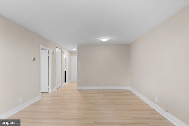 spare room featuring light hardwood / wood-style floors