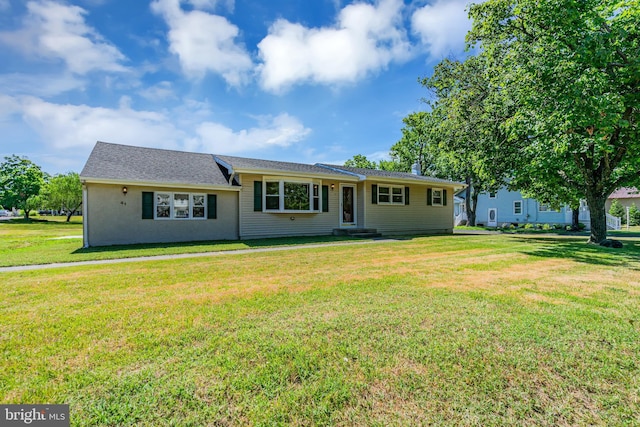 ranch-style house with a front lawn