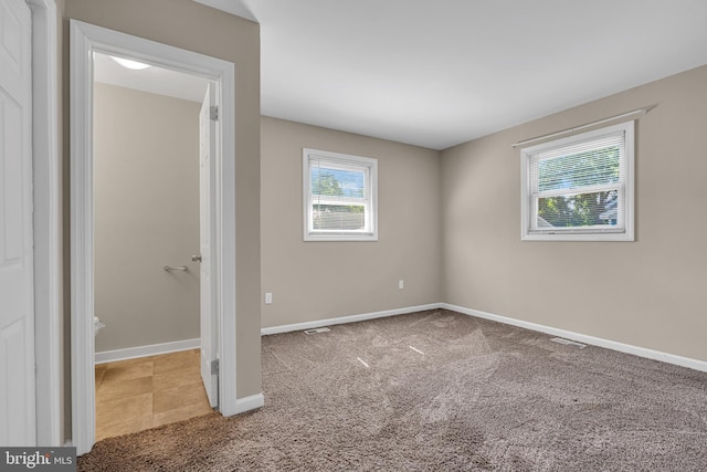 unfurnished bedroom featuring carpet floors