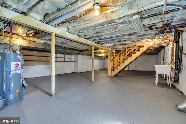 basement with sink and water heater