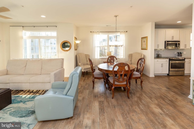 dining room with dark hardwood / wood-style floors