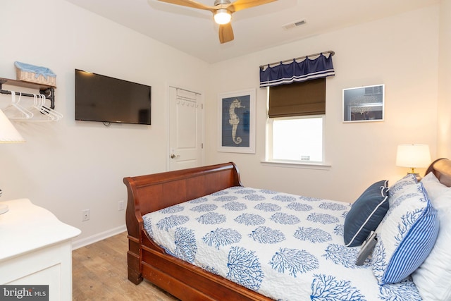 bedroom featuring ceiling fan and light wood-type flooring