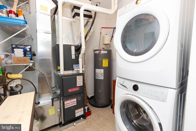 laundry room with stacked washer / dryer, water heater, and light tile patterned floors