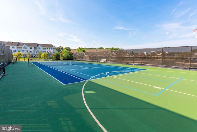 view of basketball court featuring tennis court