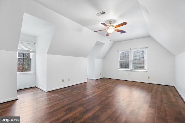 additional living space with ceiling fan, dark wood-type flooring, and lofted ceiling