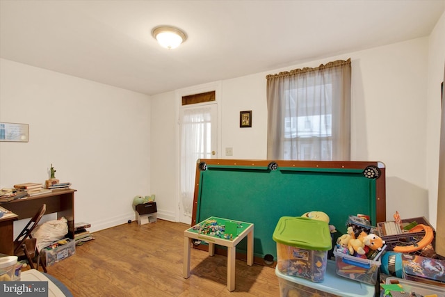 game room with hardwood / wood-style flooring and pool table