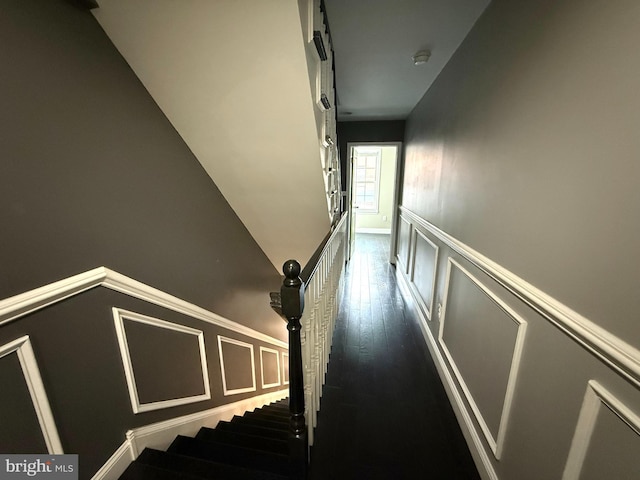 stairs with hardwood / wood-style floors