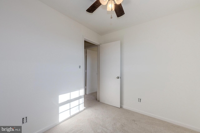 unfurnished room with light carpet and ceiling fan