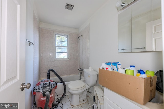 full bathroom featuring tile patterned flooring, vanity, tiled shower / bath combo, and toilet