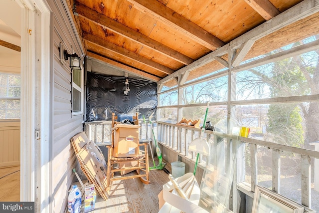 sunroom / solarium with wood ceiling and lofted ceiling with beams