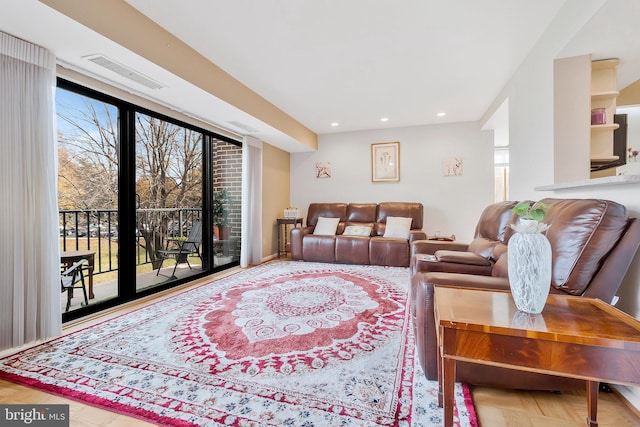 living room featuring plenty of natural light and wood-type flooring