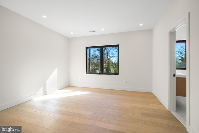 spare room featuring light hardwood / wood-style floors