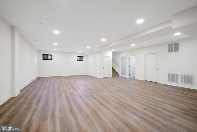 basement featuring light hardwood / wood-style flooring