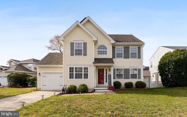 view of front of house featuring a garage and a front lawn