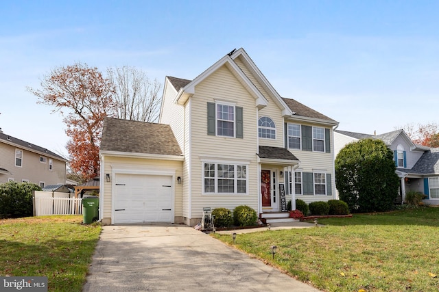 view of front of home featuring a front lawn and a garage