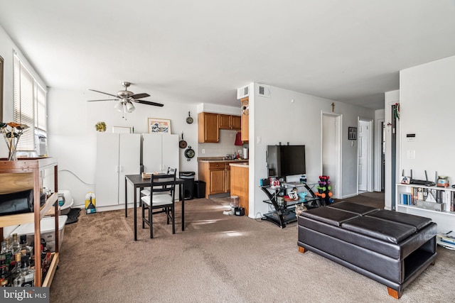 living room featuring ceiling fan and carpet floors