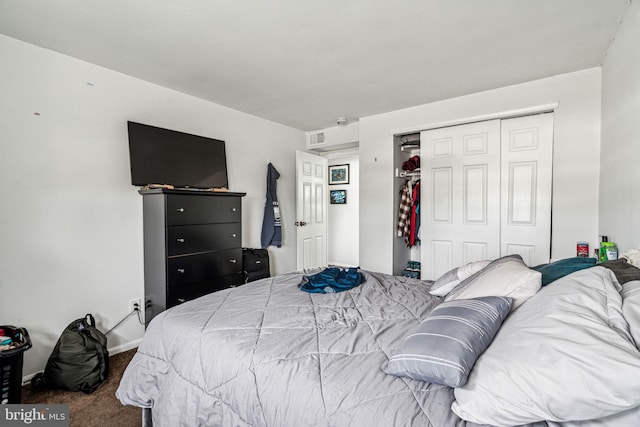 carpeted bedroom featuring a closet