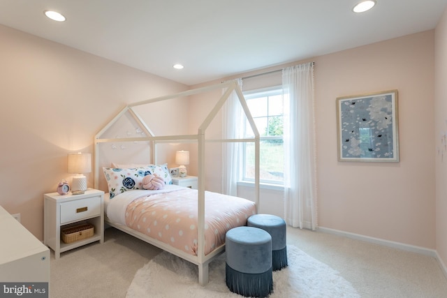 bedroom with light colored carpet