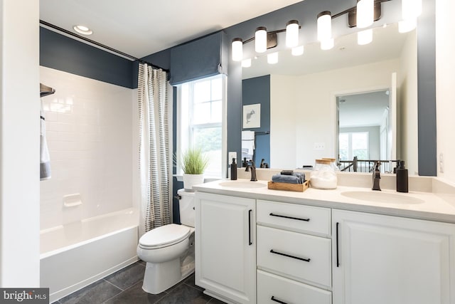 full bathroom featuring plenty of natural light, toilet, shower / bath combo with shower curtain, and vanity