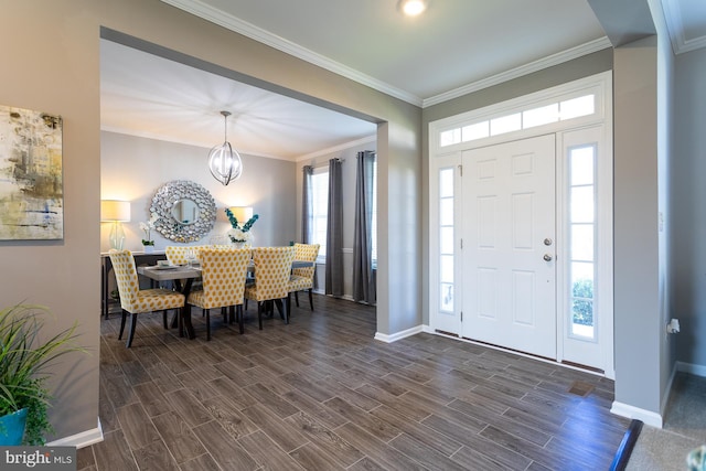 entrance foyer featuring a chandelier and ornamental molding