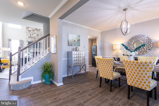 dining space featuring crown molding and an inviting chandelier