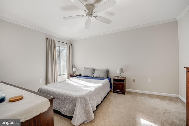 carpeted bedroom featuring ceiling fan and ornamental molding