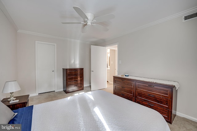 carpeted bedroom featuring ceiling fan, ensuite bathroom, and crown molding