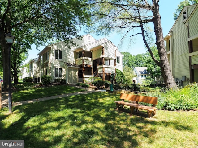 back of house featuring a yard