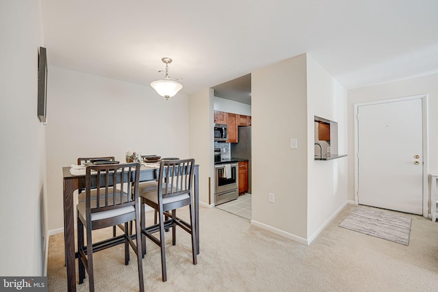 view of carpeted dining space