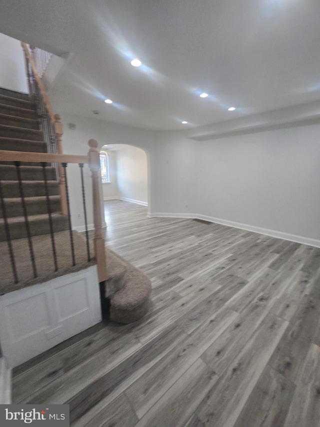 basement featuring hardwood / wood-style flooring