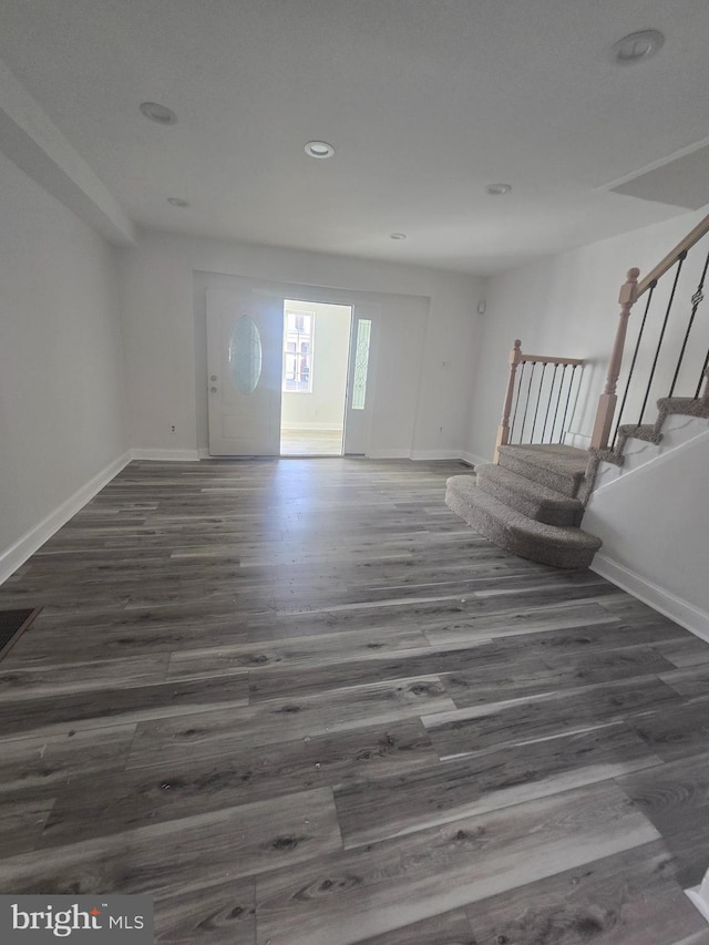 foyer entrance featuring dark hardwood / wood-style flooring