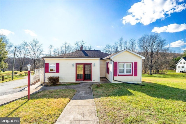 ranch-style home with a front yard