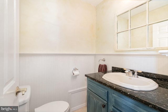 4229 Roundtop Rd, Elizabethtown, PA 17022 - half bath with vanity and a wainscoted wall