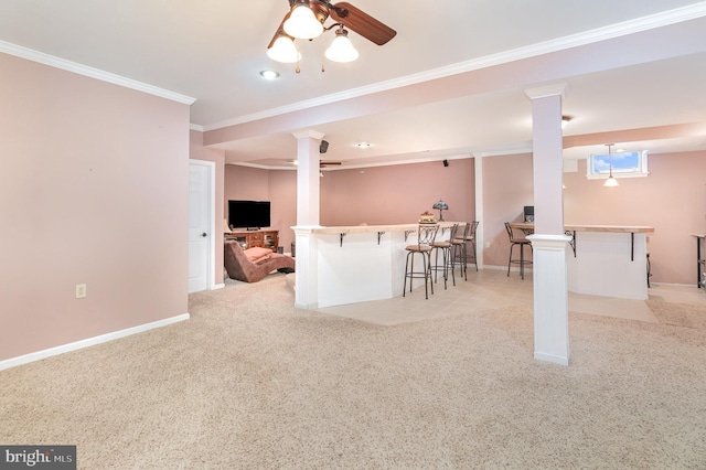 interior space featuring bar, ceiling fan, ornamental molding, and light colored carpet