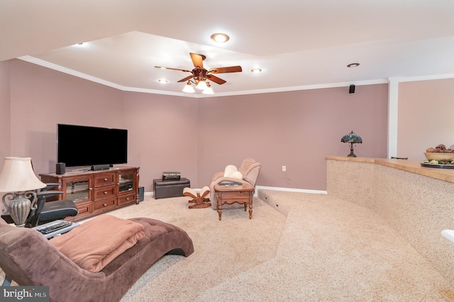 living room with ceiling fan, crown molding, and carpet flooring